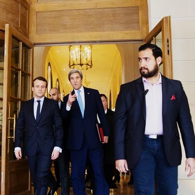 Alexandre Benalla with U.S. Secretary of State John Kerry and President Emmanuel Macron